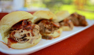 pulled pork sliders on a white plate